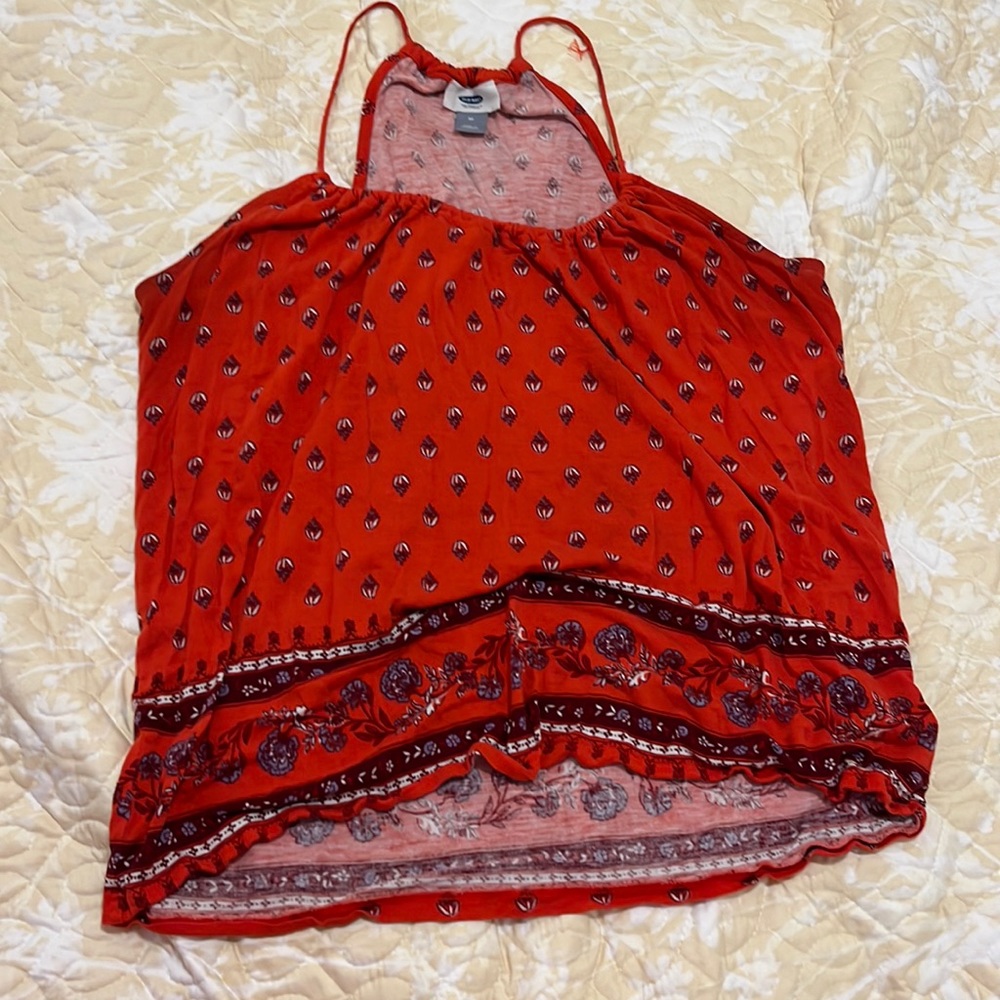 This is a red top and is great to wear to a rodeo event or a country event.